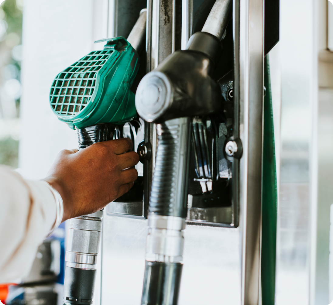 man grabbing fuel nozzle